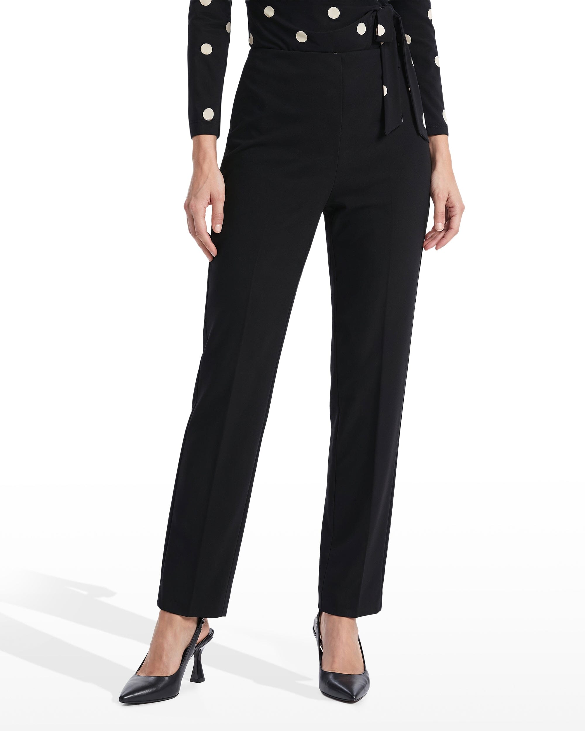 Black slim ankle pull-on pant with Hollywood waist, worn with a black jacket in a studio setting.
