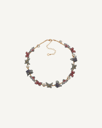 Product Coming Soon. Anne Klein collar necklace in rose gold tone with butterfly and floral charms in red, purple, and grey enamel with pearl accents