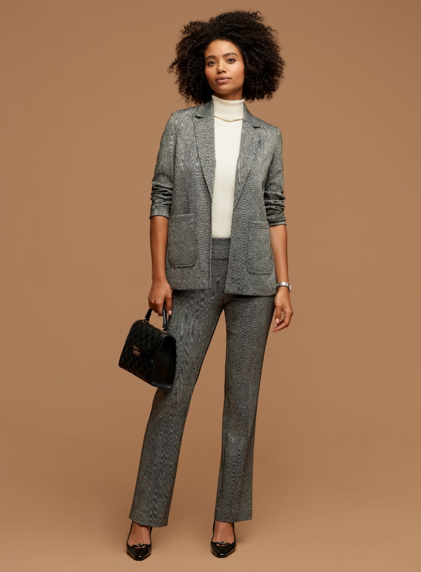 model wearing anne klein jacket and pants. 