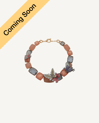 Product Coming Soon. Anne Klein beaded bracelet with terracotta and grey stone links accented with butterfly and floral charms in rose gold tone