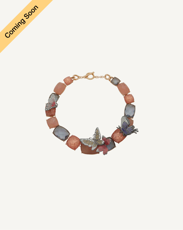 Product Coming Soon. Anne Klein beaded bracelet with terracotta and grey stone links accented with butterfly and floral charms in rose gold tone