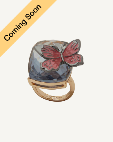 Product Coming Soon. Anne Klein cocktail ring in gold tone with a faceted blue stone and red butterfly charm overlay