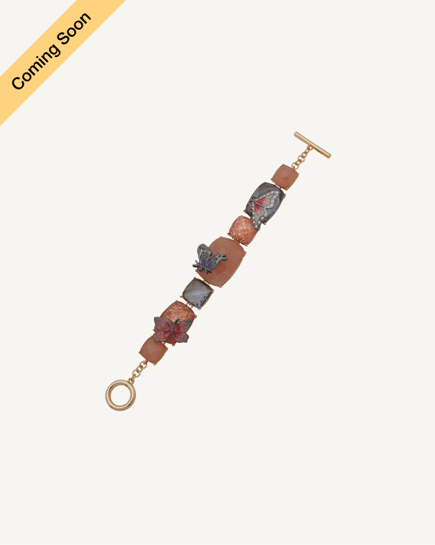 Product Coming Soon. Anne Klein toggle bracelet with terracotta and grey rectangular stone links and butterfly charms in rose gold tone