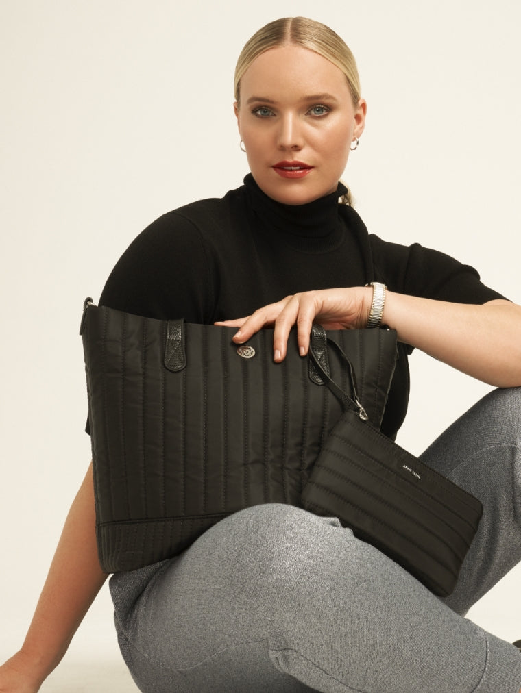 Anne Klein model with black nylon tote bag