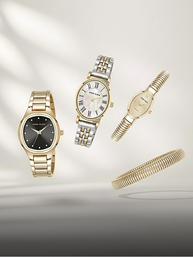 Four elegant wristwatches and a bracelet floating against a soft light background
